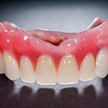 Upper full denture on black background