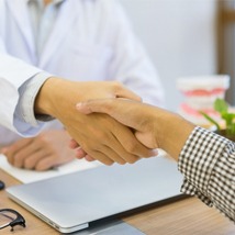 Dentist patient handshake