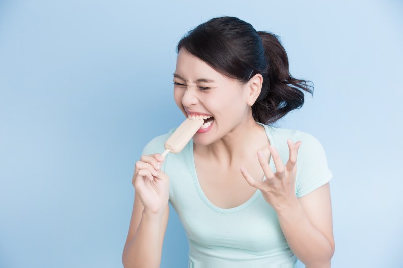 woman frowning from tooth pain