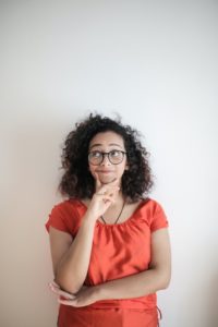 Woman contemplating crowns or veneers in Tomball