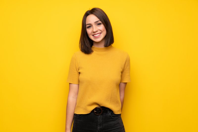 person with porcelain veneers smiling 